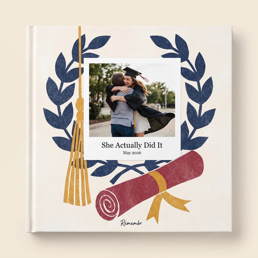 Cap and Gown — an 11×11 hardcover reading “She Actually Did It, May 2026”
